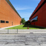 Adalberto Dias's design of the Autonomous Section of Mechanical Engineering at the University of Aveiro showcasing brickwork and composite materials with daylighting features on the campus.