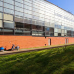 Adalberto Dias's design of the Autonomous Section of Mechanical Engineering at the University of Aveiro showcasing brickwork and composite materials with daylighting features on the campus.