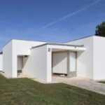 Álvaro Siza Vieira's 14 Villas at Bom Sucesso Resort showcasing a modern design with a concrete facade, composite material elements, and a central courtyard.