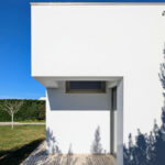 Álvaro Siza Vieira's 14 Villas at Bom Sucesso Resort showcasing a modern design with concrete walls, composite materials, and ample daylighting during daytime.