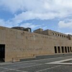Álvaro Siza Vieira's Leça da Palmeira Seafront Avenue Urban Plan showcasing a Brutalist architecture style with a concrete facade, composite materials, and prominent columns during daytime.