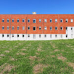 Bernardo Ferrão's Institute of Electronic Engineering and Telematics at the University of Aveiro showcasing a modern urban design with a sleek glass façade and a science campus setting.