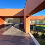Carrilho da Graça's 14 Houses at Quinta do Bom Sucesso Resort showcasing modern architecture with concrete structures, composite materials, and tiled surfaces, enhanced by strategic daylighting and shaded areas.