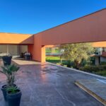 Carrilho da Graça's 14 Houses at Quinta do Bom Sucesso Resort showcasing modern architecture with concrete structures, composite materials, and eco-friendly landscaping surrounding a central courtyard.