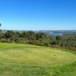Donald Steel's design of the Bom Sucesso Resort Golf Course showcasing expansive grasslands, meticulously maintained fairways, and a scenic landscape ideal for golf enthusiasts.