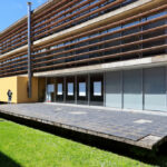 Eduardo Souto de Moura's Department of Geo-sciences at the University of Aveiro showcasing a modern concrete structure with composite materials, daylighting features, and shaded areas.