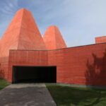 Eduardo Souto de Moura's House of Stories Paula Rego showcasing a symmetrical triangular structure with ample daylighting.