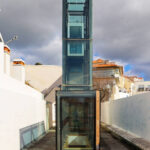 Gonçalo Byrne's Urban Requalification of São Martinho do Porto showcasing a modern design with composite materials, extensive use of glass for daylighting, and a sleek, contemporary aesthetic.