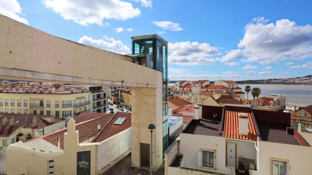 Gonçalo Byrne's Urban Requalification of São Martinho do Porto showcasing a mixed-use development with composite materials, glass façades, and balconies integrated into the urban design.