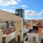 Gonçalo Byrne's Urban Requalification of São Martinho do Porto showcasing composite material structures with balconies, handrails, and ample daylighting during daytime.