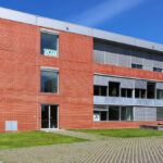 Jorge Kol de Carvalho's Department of Communication and Arts at the University of Aveiro showcasing a brick façade with daylighting elements and engineering features on the campus.