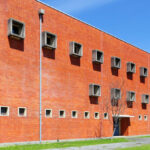Jorge Kol de Carvalho's Department of Communication and Arts at the University of Aveiro showcasing urban design with a brick exterior and modern building materials on a university campus.