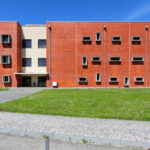 Jorge Kol de Carvalho's Department of Communication and Arts at the University of Aveiro showcasing a modern urban design with a sleek glass façade and integrated campus elements.