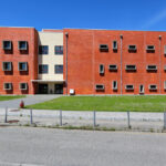 Jorge Kol de Carvalho's Department of Communication and Arts at the University of Aveiro showcasing a modern facade with urban design elements, including a public space and community center features.