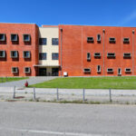 Jorge Kol de Carvalho's Department of Communication and Arts at the University of Aveiro showcasing a modern urban design with a sleek glass façade, open public spaces, and integrated campus elements.