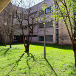 José Carlos Loreiro's Department of Biology I at the University of Aveiro showcasing a modern concrete structure with shaded walkways, a courtyard, and a driveway.