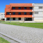 José Maria Lopo Prata's Department of Education, University of Aveiro, showcasing Brutalist architecture with concrete and composite materials, featuring urban design elements on the university campus.