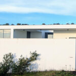 Josep Llinás's 6 Villas at Bom Sucesso Resort showcasing a modern design with concrete structures, strategic daylighting, and prominent shadows.