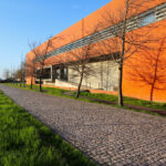 Manuel Aires Mateus and Francisco Aires Mateus' "Canteen and Dining Halls, University of Aveiro" showcasing composite material structures with shaded walkways and daylighting elements on a university campus.