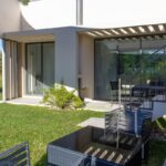 Manuel Graça Dias and Egas José Vieira's 13 Round Houses at Bom Sucesso Resort showcasing modern architecture with concrete structures, shaded balconies, landscaped gardens, and urban design elements.