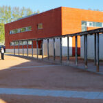 Maria Emília Pedroso Lima's design of the Higher Institute of Accounting and Administration, University of Aveiro, showcasing a public space with shaded walkways and recreational areas on the campus.