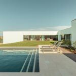 Nuno Graça Moura's 8 Villas at Bom Sucesso Resort showcasing modern design with landscaped courtyards, daylighting features, and shaded lawn areas.