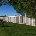 Nuno Graça Moura's Bar Code 2 - 12 Row Houses at Bom Sucesso Resort showcasing a modern design with extensive use of daylighting, landscaping, and prominent shadows.