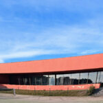 Nuno Graça Moura's Tennis Club at Bom Sucesso Resort showcasing a modern design with prominent concrete structures.