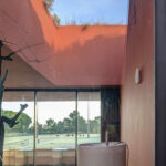 Nuno Graça Moura's Tennis Club at Bom Sucesso Resort showcasing a modern concrete structure with prominent walls and strategic daylighting creating dynamic shadows.