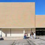 Vítor Figueiredo's Pedagogic Scientific and Technological Centre at the University of Aveiro showcasing a clean public space with concrete flooring and composite materials, designed for pedestrian use on the campus.