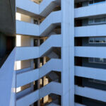 Adalberto Dias’s Casas Brancas featuring a high-rise apartment and commercial building with composite material façade, concrete structural elements, and extensive daylighting design.