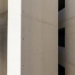 Adalberto Dias’s Casas Brancas showcasing a symmetrical white concrete structure with composite materials, featuring a silver-toned ceiling and modern design elements.