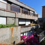 Agostinho Ricca’s Igreja do Foco / Igreja de Nossa Senhora da Boavista showcasing a modern concrete structure with composite material walls, balconies, and urban residential design elements.