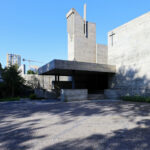 Agostinho Ricca’s Igreja do Foco / Igreja de Nossa Senhora da Boavista showcasing a brutalist architecture with composite material walls and a prominent cross structure.
