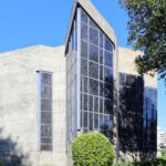 Agostinho Ricca’s Igreja do Foco / Igreja de Nossa Senhora da Boavista showcasing a modern façade with composite materials, concrete structural elements, and extensive glass panels allowing natural daylighting.