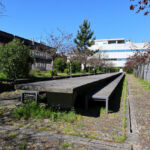 Alexandre Alves Costa and Sérgio Fernandez’s Escola de Ciências Sociais at Universidade do Minho showcasing a shaded walkway with modern structural elements and clean lines.
