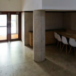 Álvaro Siza Vieira's Casa Ferreira da Costa / Casa Miranda dos Santos showcasing a modern interior with hardwood flooring, wooden ceiling, and minimalist furniture design.