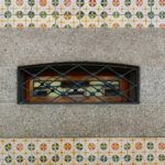 Álvaro Siza Vieira’s Casa dos Pais showcasing a symmetrical tile mosaic façade with triangular motifs and intricate design patterns.