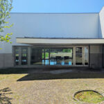 Álvaro Siza Vieira’s Centro de Estudos Camilianos showcasing a concrete and composite material structure with tiled walls, a shaded courtyard, and engineered daylighting elements.