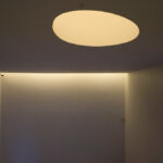 Álvaro Siza Vieira and Eduardo Souto de Moura’s Museum of International Contemporary Sculpture showcasing a minimalist plaster ceiling with integrated light fixtures.