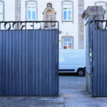 Casa Sacerdotal de São Martinho de Dume by André and António Fontes featuring a modern gate with clean lines and minimalist design elements.