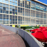 Carlos Prata and Manuel de Solà-Morales’ Edificio Transparente, a high-rise commercial building with a glass façade and composite materials, serving as a corporate headquarters in a metropolitan urban campus.
