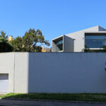 Eduardo Souto de Moura’s Casa do Cinema Manoel de Oliveira showcasing a minimalist concrete structure with strategic daylighting elements.