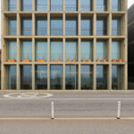 Eduardo Souto de Moura’s Edifício de Habitação e Comércio showcasing a brutalist commercial building with composite materials, large daylighting windows, and a robust corporate headquarters design.