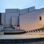 Eduardo Souto de Moura’s Fórum da Maia showcasing brutalist architecture with concrete construction, composite materials, and prominent stairs integrated into an urban design setting.