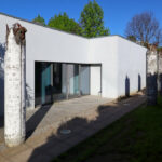 Eduardo Souto de Moura’s Mercado Municipal de Braga reconversion showcasing a concrete and composite material structure with plaster finishes, designed for daylighting and shaded areas, now serving as dance and music schools.