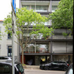 Eduardo Souto de Moura’s Residential Building showcasing a modern apartment complex with multiple balconies and sleek condominium design elements.