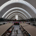 Fortunato Cabral and Cunha Leão’s Mercado de Matosinhos showcasing a modern commercial building with a spacious retail market featuring extensive daylighting and a glass façade.