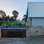House 1 to 6 designed by Jean Pierre Porcher, Joaquim Oliveira, and Albino Freitas featuring modern concrete construction with integrated driveway, garage doors, and spacious garages.