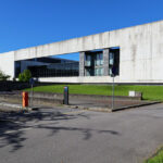OPERA | Design Matters' Escola de Medicina, Universidade do Minho, showcasing a modern concrete and composite material structure with extensive daylighting, shaded façades, and campus-style corporate headquarters design.